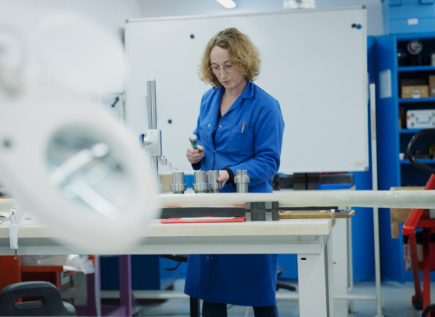 A woman employed by REEL international carries out quality controls