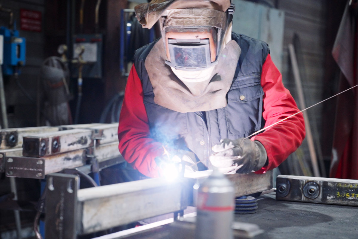 welder in full manufacturing mode for REEL international